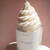 Coconut Soft Serve sugar scrub with a whipped swirl piped over the open jar by Sunday Forever