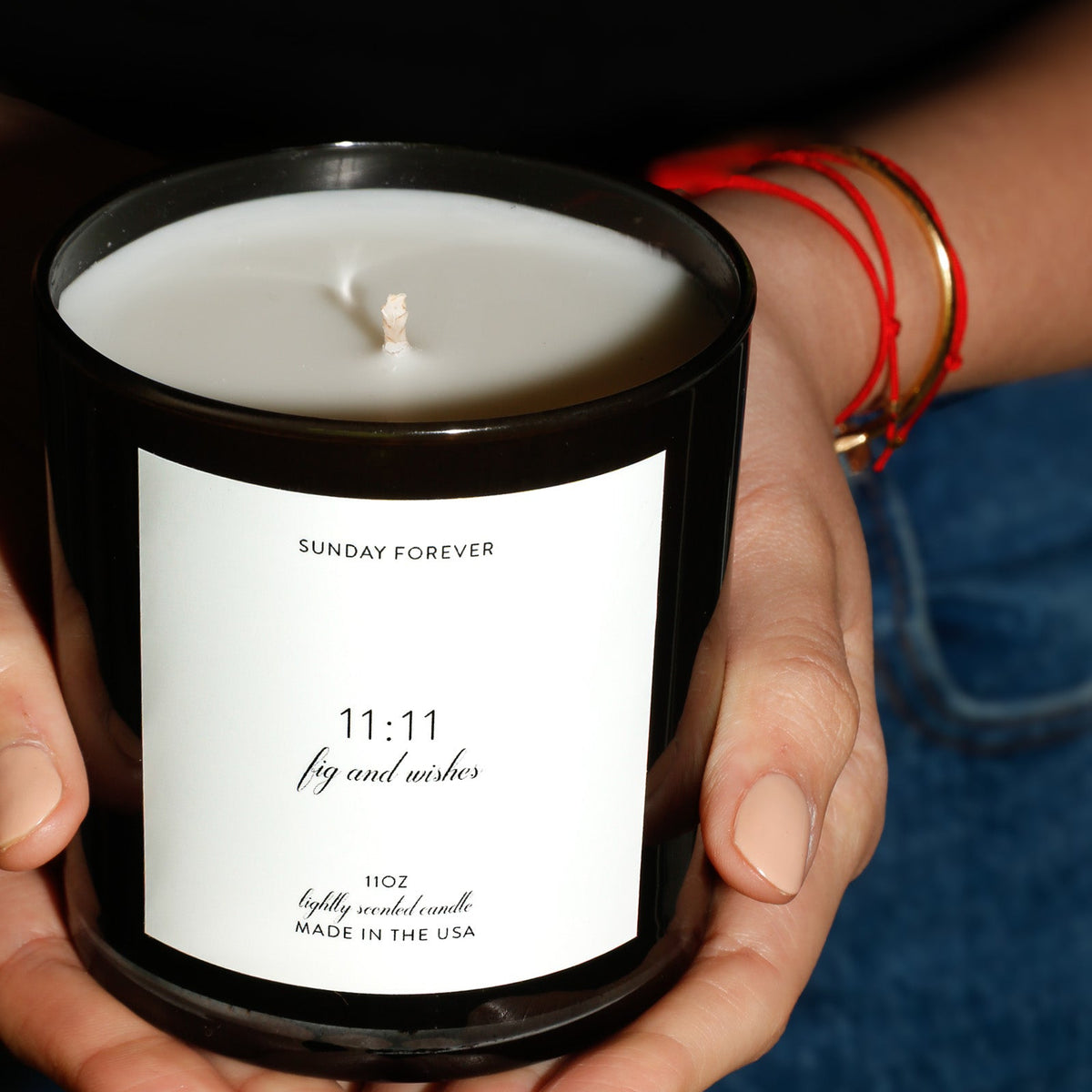 Sunday Forever 11:11 candle in hands
