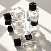 Six stacked eau de parfum minis from the Scent Discovery Set by Sunday Forever