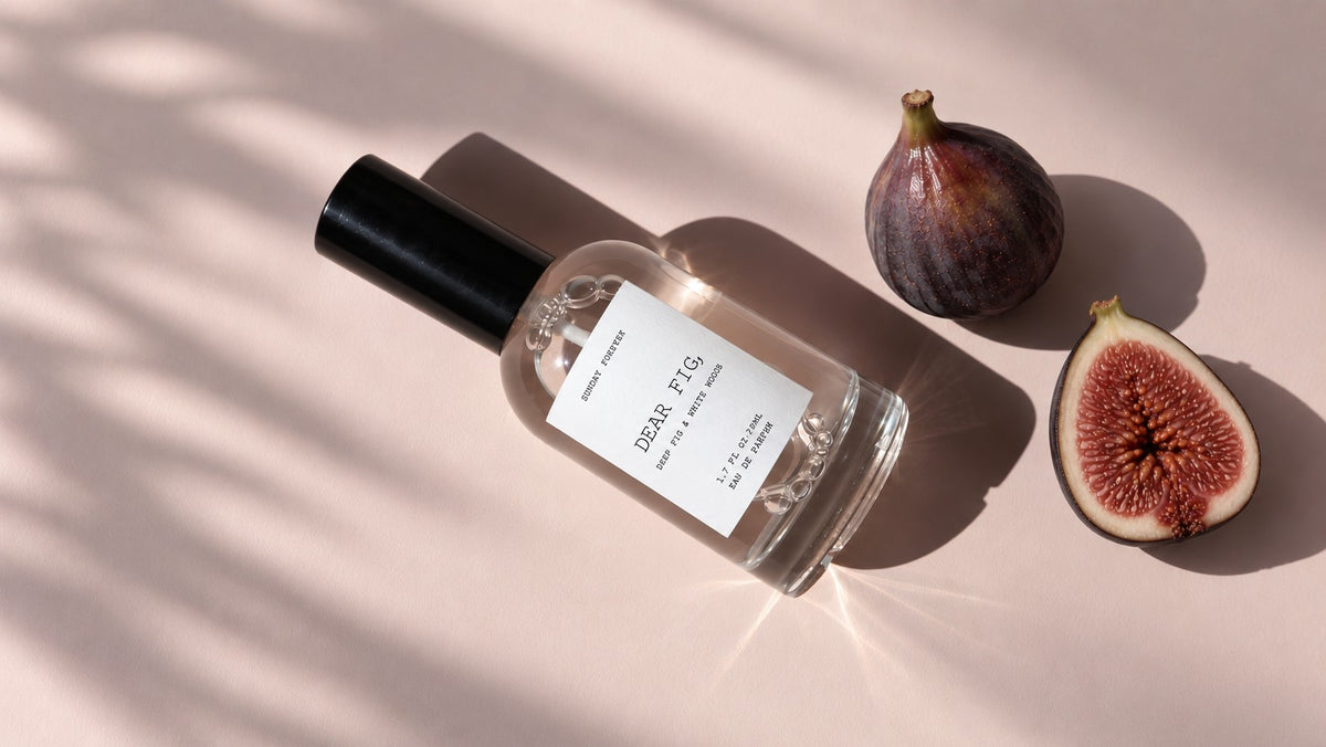 Dear Fig, Eau de Parfum lying in warm light beside figs by Sunday Forever