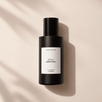 Sunday Forever Rich Eau de Parfum 1.7 oz bottle, cashmere and smoke label, lying on a sunlit surface