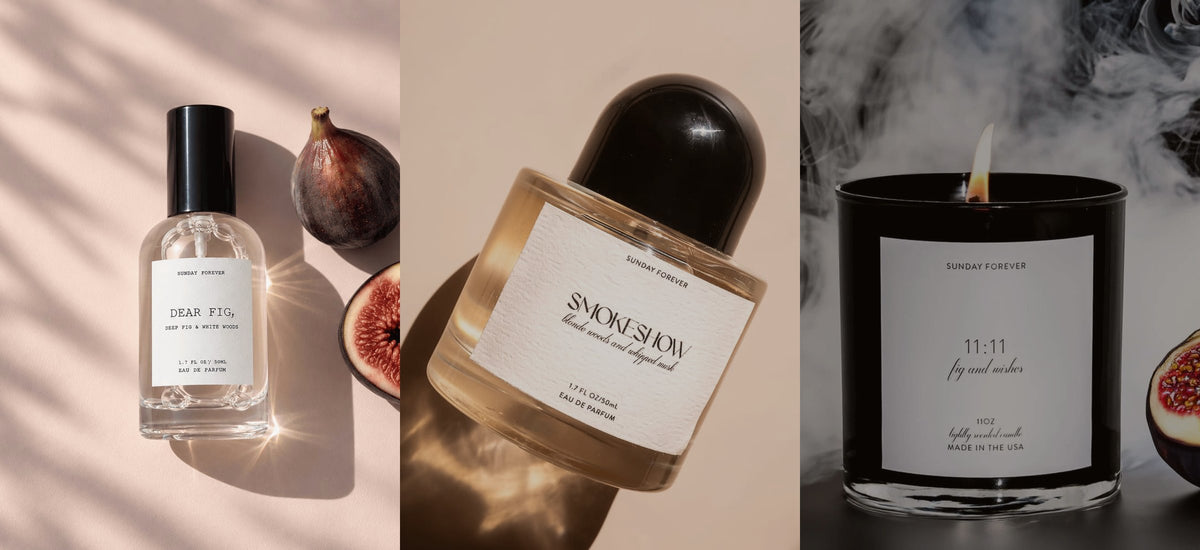 A lit 11:11 candle with smoke and a halved fig, beside Dear Fig and Smokeshow perfume